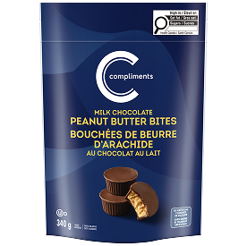 Bouchées au chocolat au lait et au beurre de cacahuète Compliments dans un sac bleu