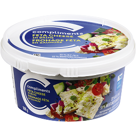 A tub of Compliments Feta Cheese